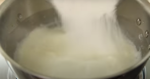 Mixing Cornstarch and Salt Mixture into Warm Milk

