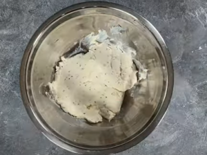 Combining regular cream cheese with garlic and herb cream cheese