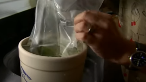  Placing the Full of Brime Zip-Lock Bag on the Cucumber Jar