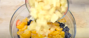 Adding Pineapple Tidbits to the Fruits Mixture