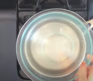 Pan on the top of a Saucepan of Boiled Water