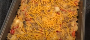 Sprinkle Shredded Cheddar Cheese over the Mixture