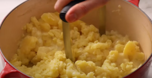 Mash the Potato using A Potato Masher