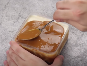 Spread Caramel Sauce over the Cheese Mixture