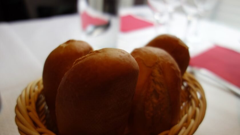 Basket of warm Texas Roadhouse copycat rolls with cinnamon honey butter