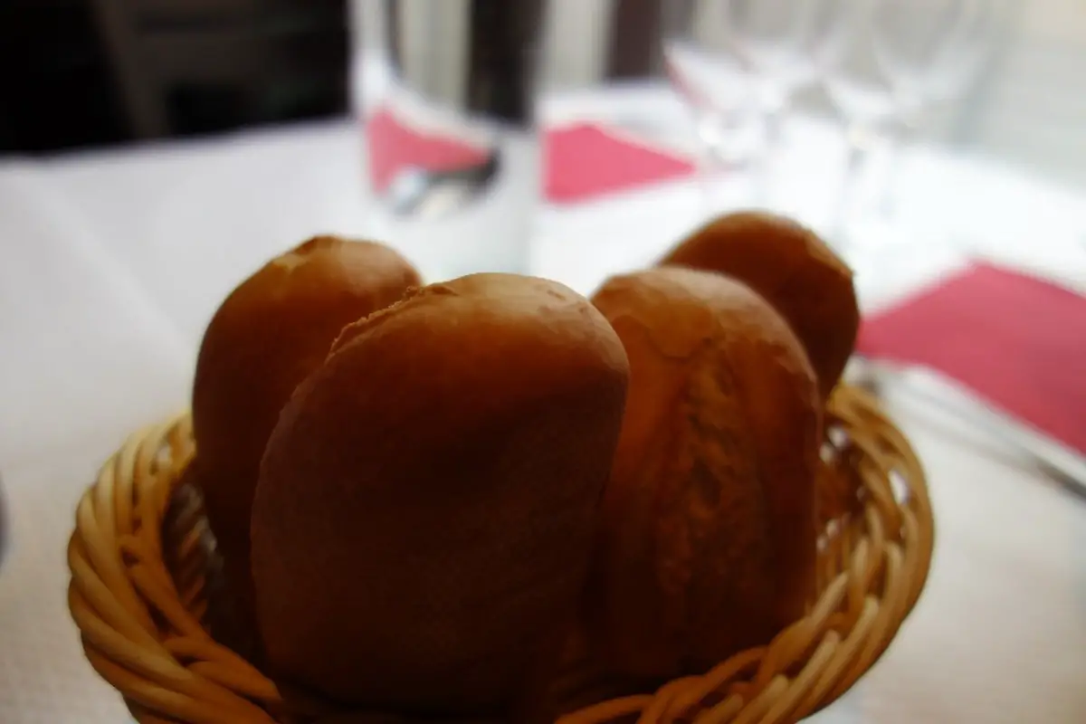 Basket of warm Texas Roadhouse copycat rolls with cinnamon honey butter